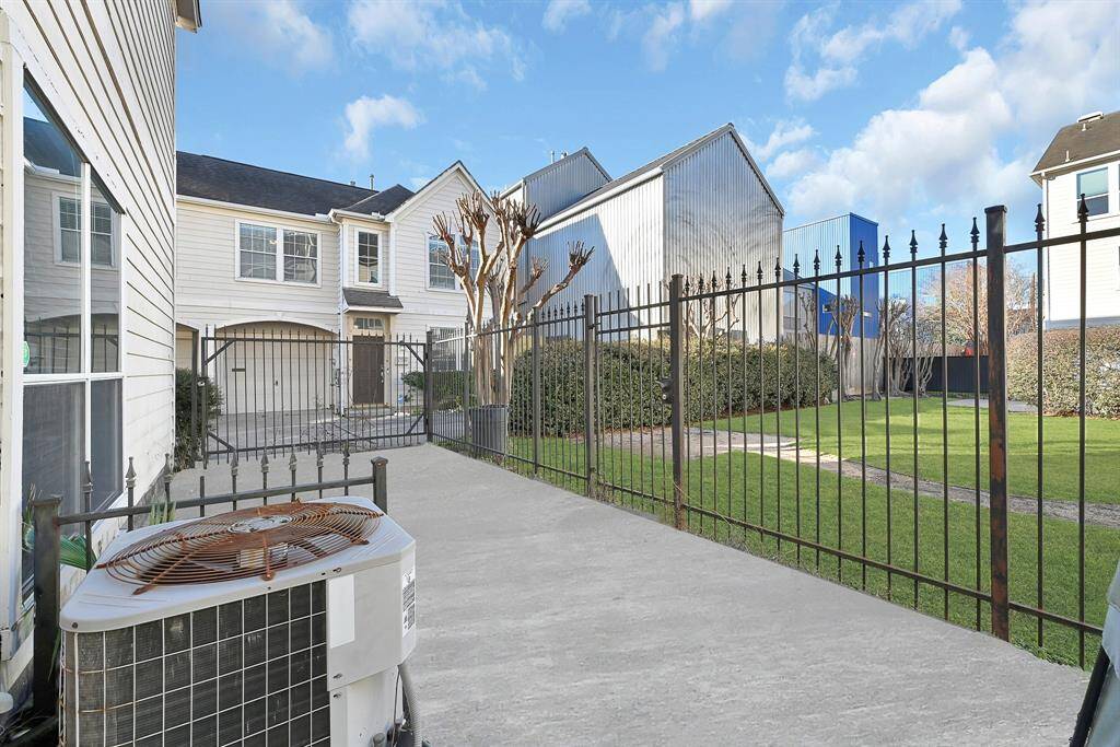 Secure gated driveway offering privacy and convenience.
