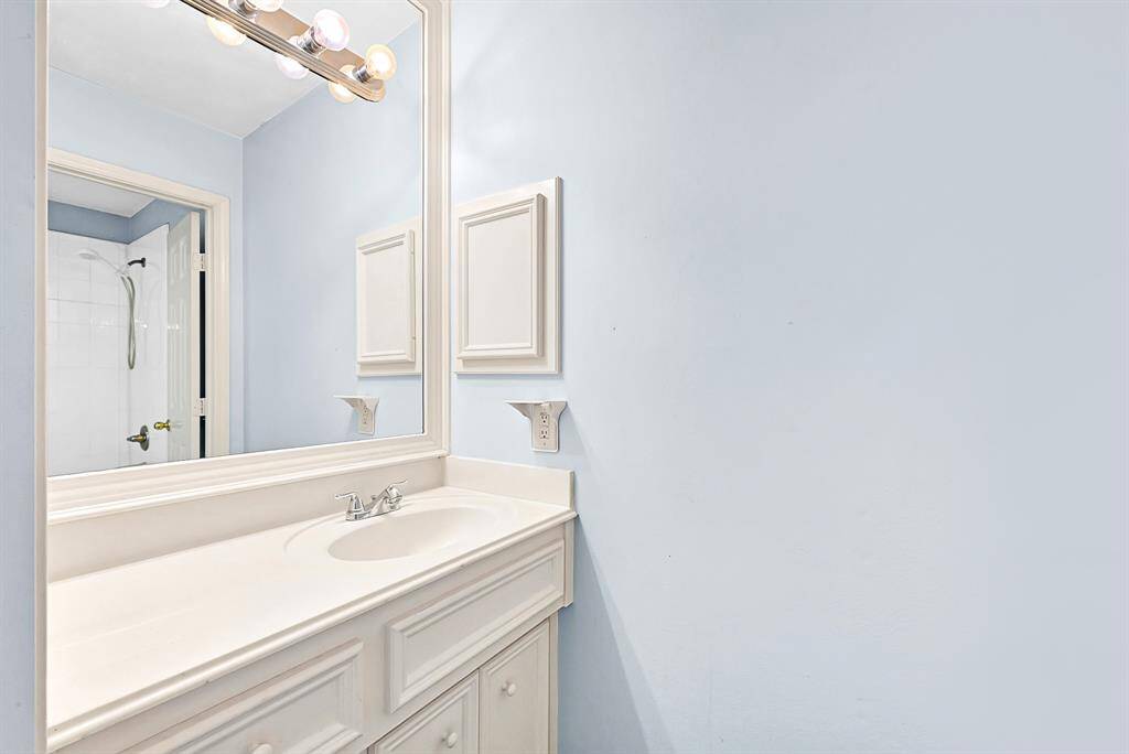 Luxurious master vanity with elegant fixtures and ample counter space.