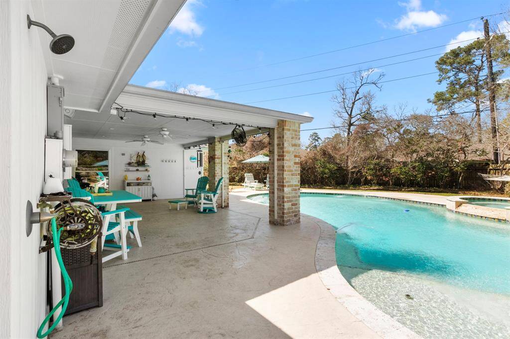 Covered patio with view of pool.