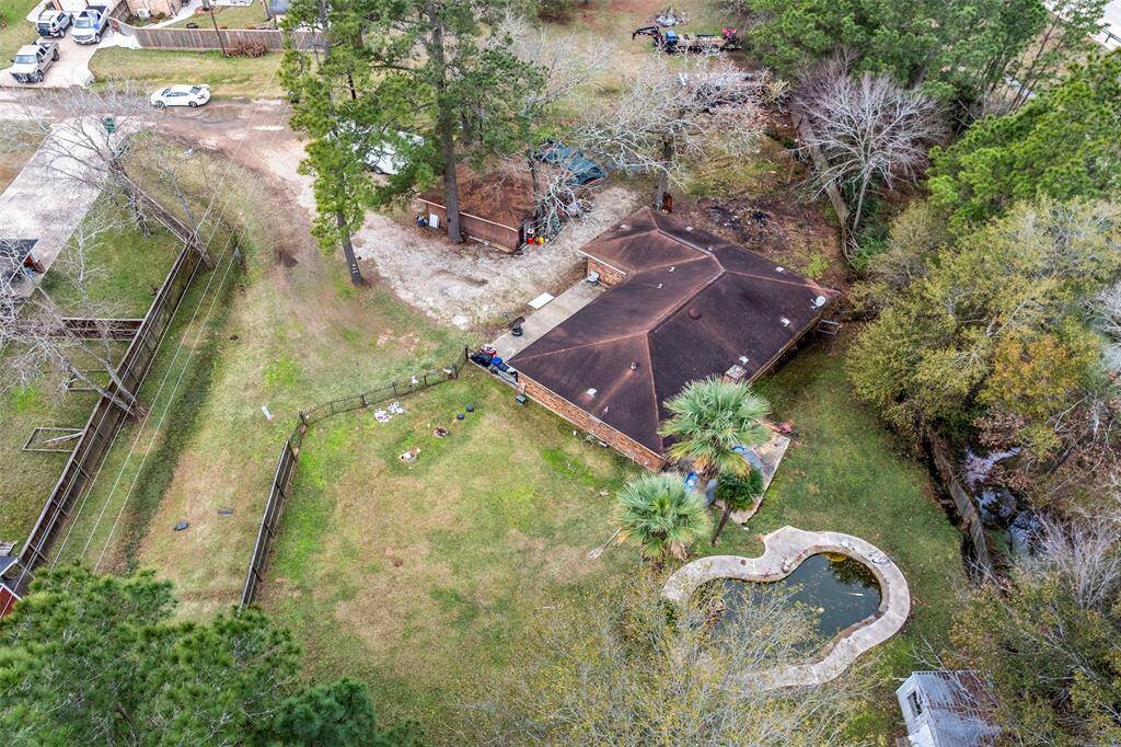 Priced to Sell! Brick Ranch Style home sits on a double lot of approximately an acre of land with no rear neighbors and close to FM 1488 & HWY 249.