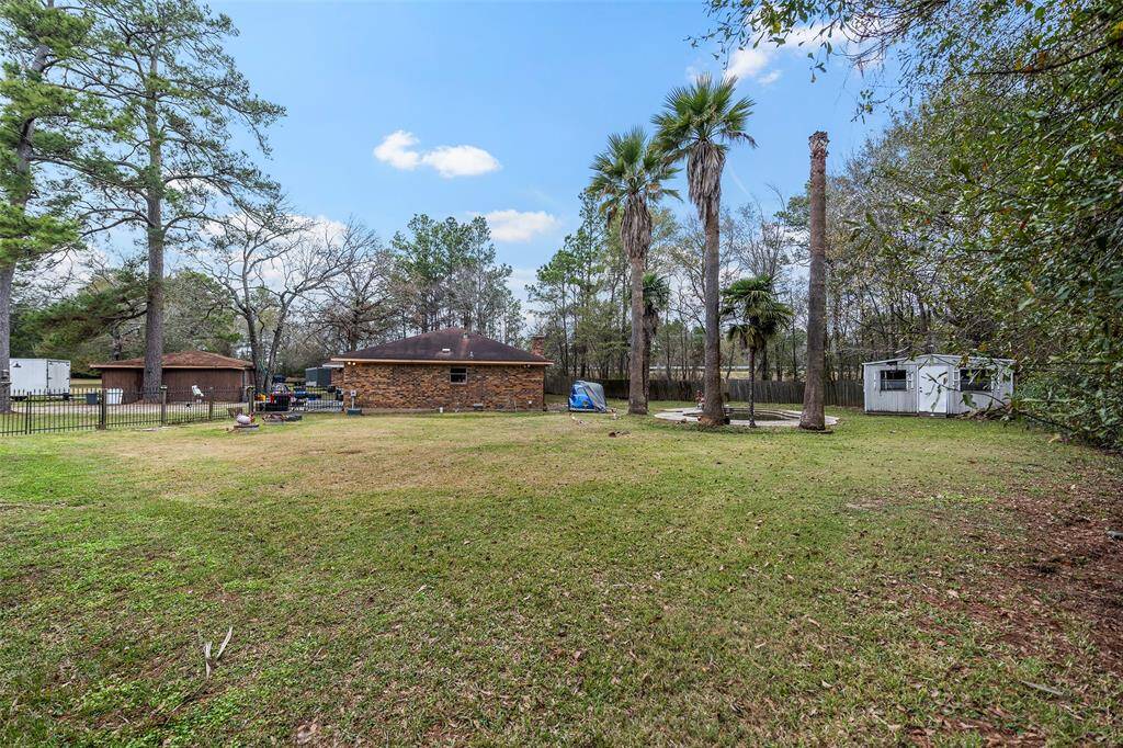 Brick Ranch Style home sits on a double lot of approximately an acre of land