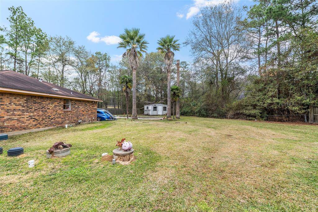 Brick Ranch Style home sits on a double lot of approximately an acre of land