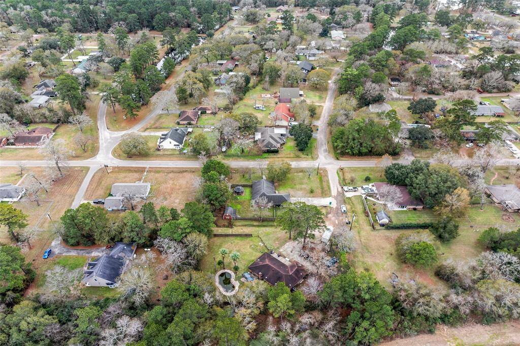 Brick Ranch Style home sits on a double lot of approximately an acre of land. Home is close to FM 1488 and HWY 249