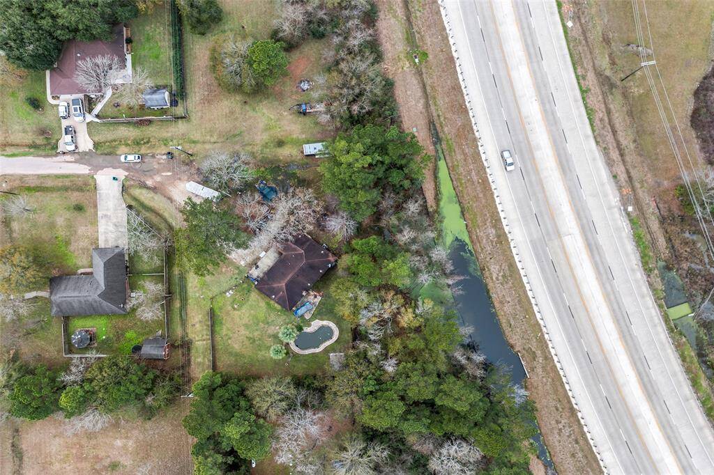 Brick Ranch Style home sits on a double lot of approximately an acre of land. Home is close to FM 1488 and HWY 249