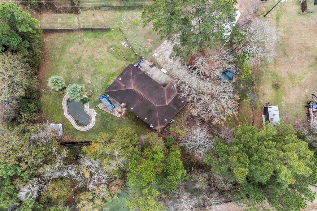 Brick Ranch Style home sits on a double lot of approximately an acre of land. Home is close to FM 1488 and HWY 249