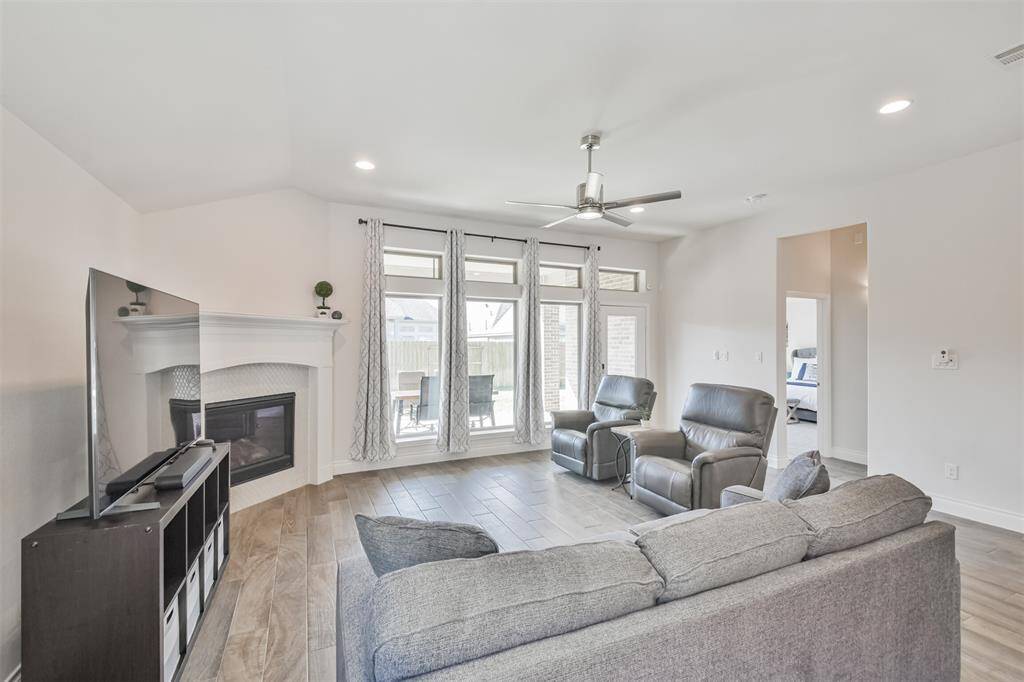 Spacious living room is light and bright.