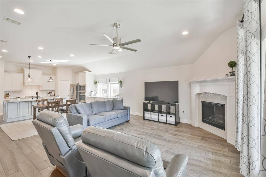 This entire area is filled with natural light with lots of space for relaxing or entertaining.