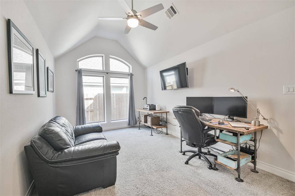 The vaulted ceiling and high windows give this room an airy feeling.