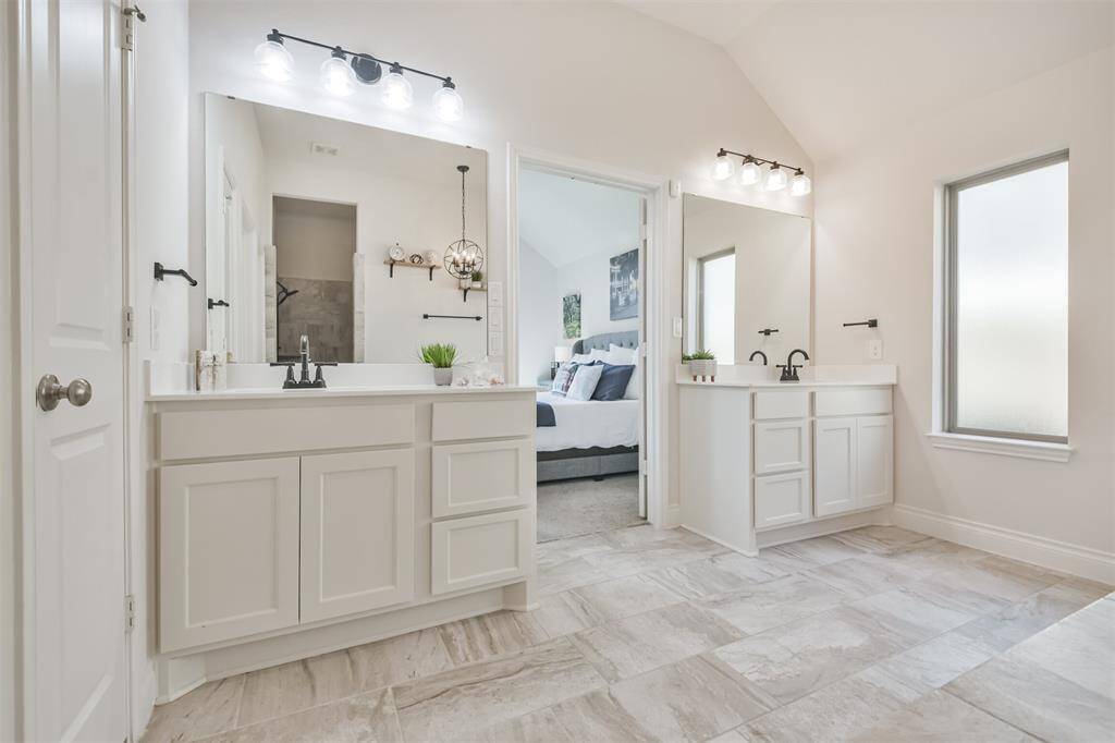 Double vanities include ample storage and upgraded fixtures.