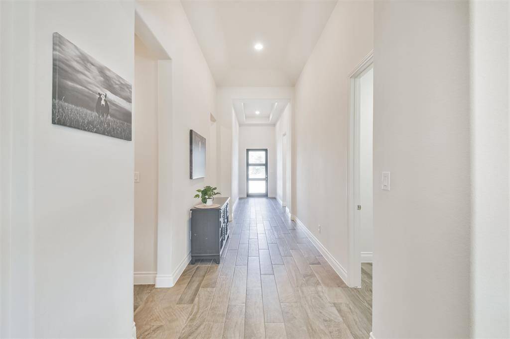 Spacious entry hall with wood look tile