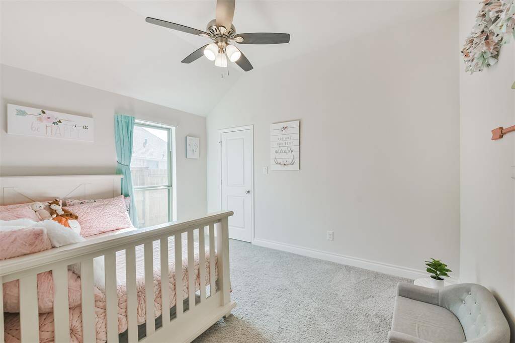 Third bedroom with ceiling fan and walk-in closet
