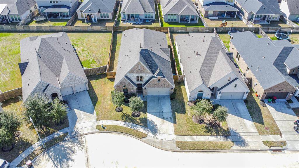 Long driveway and more space between houses is a plus for this home's location.