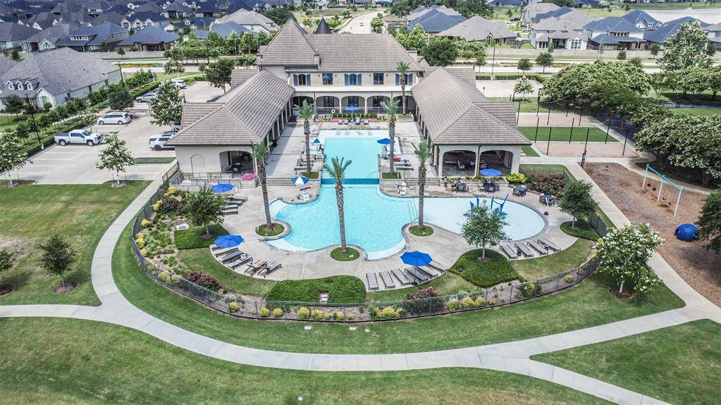 Amira Resort with pool, party room, and fitness center