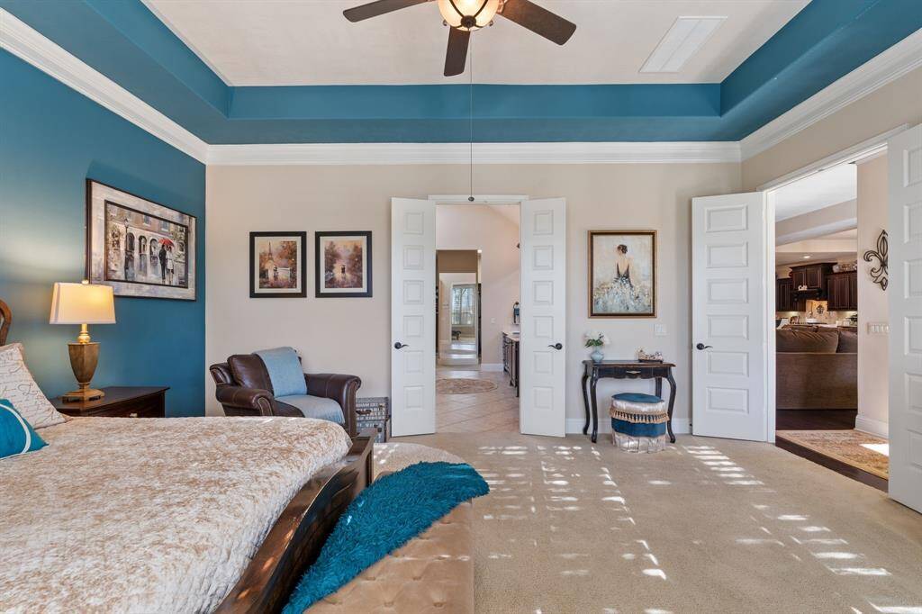 Tray ceiling FEATURE with CUSTOM shutters in the bedroom