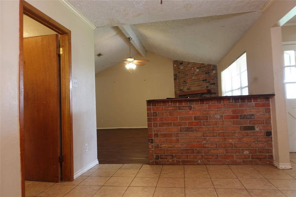 Inviting bar and living area, perfect for entertaining, as seen from the formal dining room.