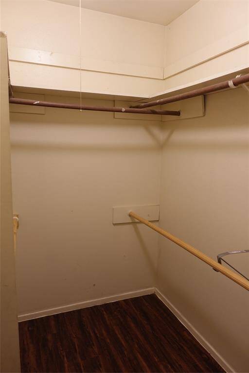 Expansive master bedroom walk-in closet offering ample storage space and organization potential.