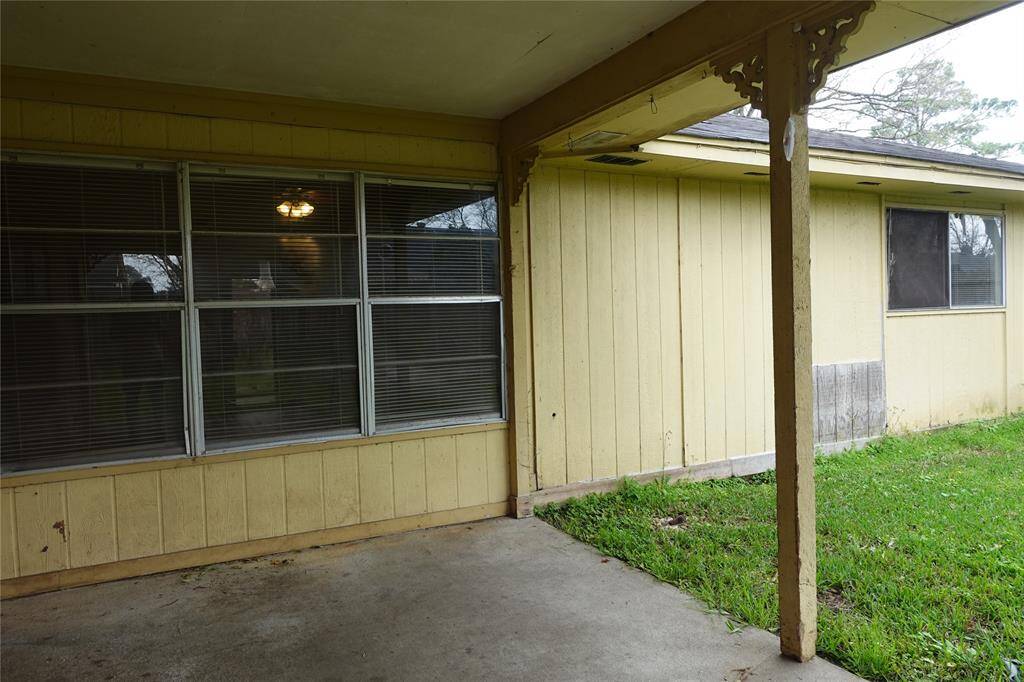 Enjoy the cozy covered patio with views from the living area. Exciting update: All siding has been replaced!