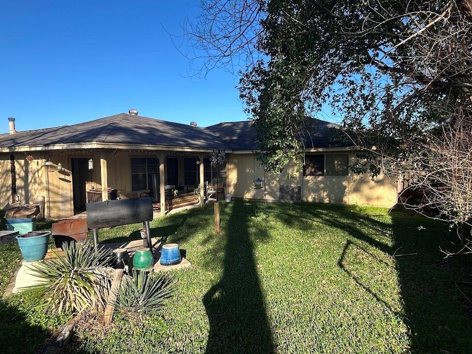 Secure and spacious backyard with a concrete slab, perfect for BBQs.