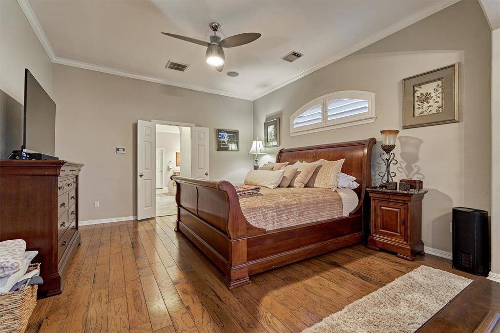 Custom wood blinds above primary bed.