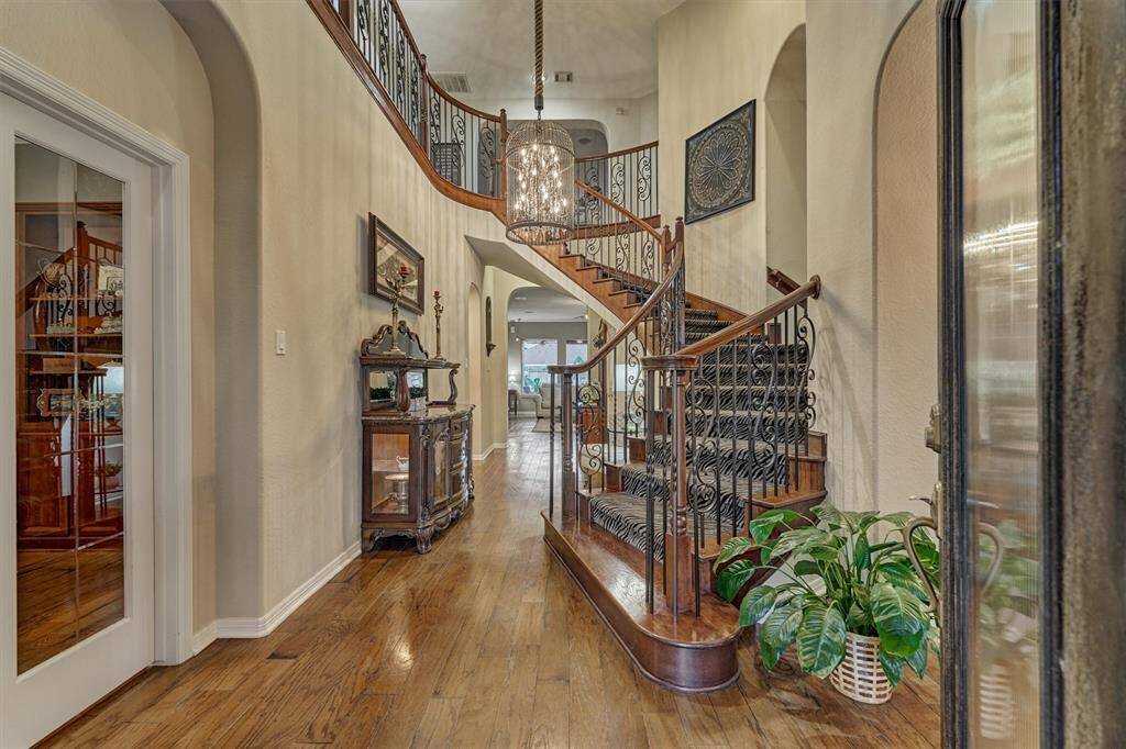 Grand entryway with office/study to the left and formal dining on the right.