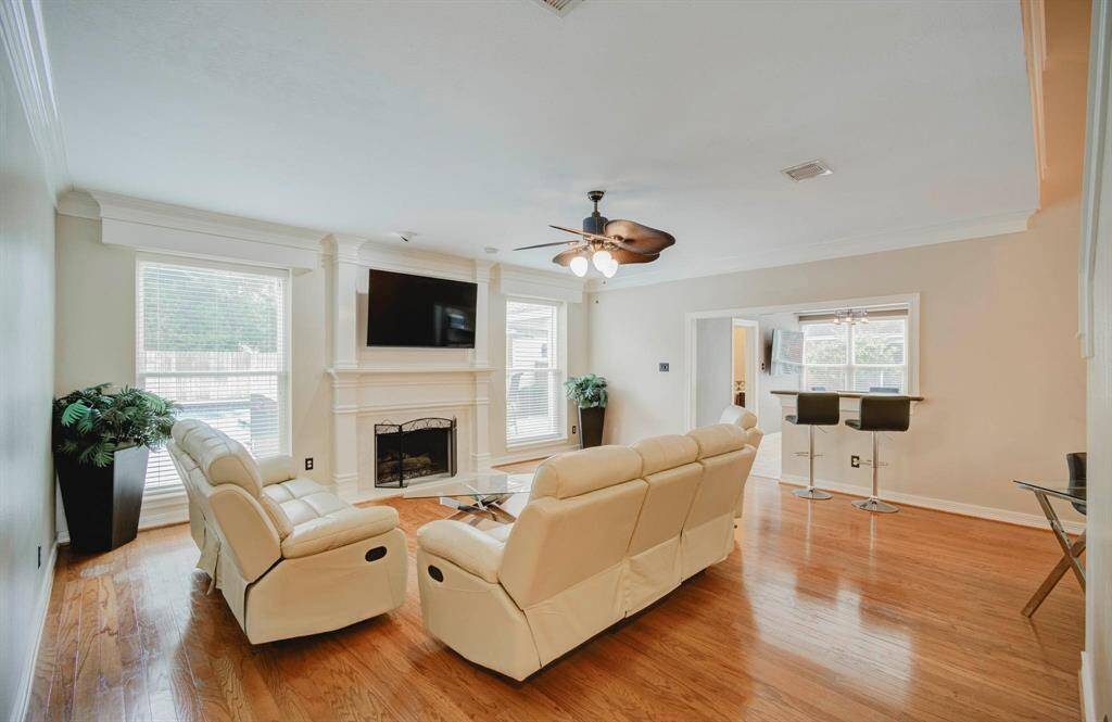 Spacious living room with an open floor plan, perfect for accommodating furniture and hosting family gatherings.
