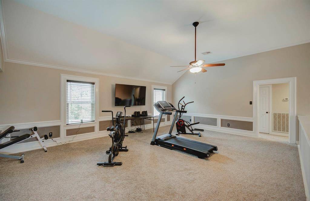 Spacious second-floor game room perfect for family entertainment.