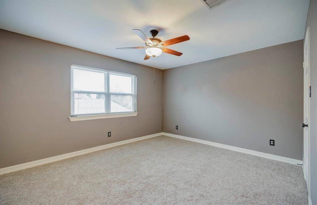 Spacious third bedroom perfect for accommodating guests.