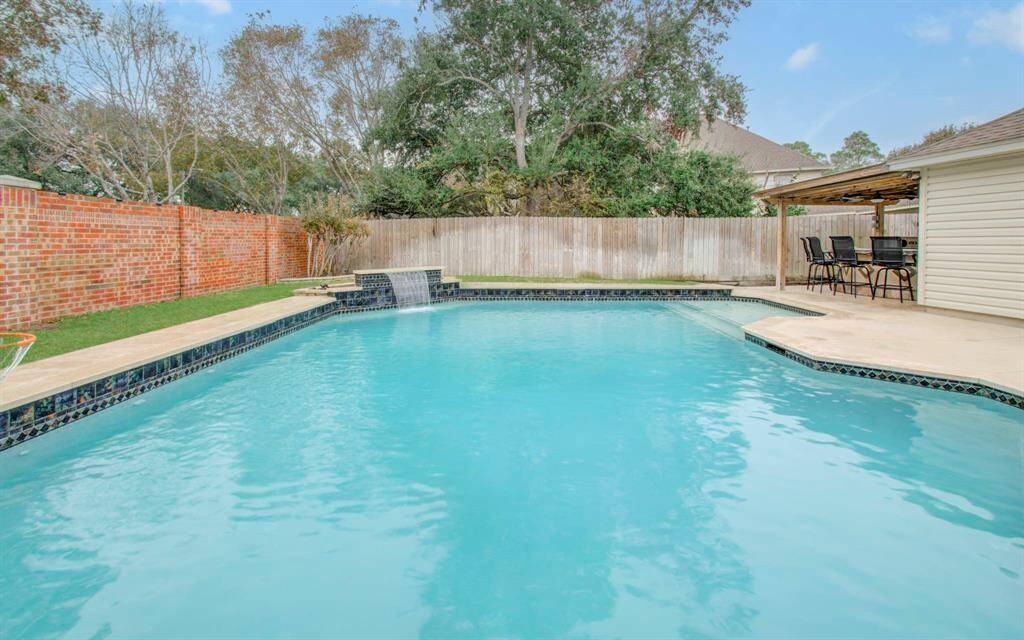 Enjoy endless staycations in this stunning backyard oasis.