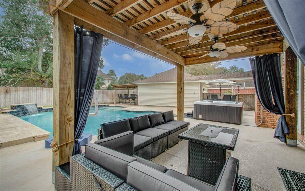 Experience endless entertaining possibilities in this stunning backyard oasis.