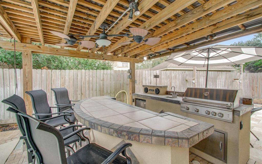 Enjoy summer BBQs in your spacious outdoor kitchen, perfect for the family chef.
