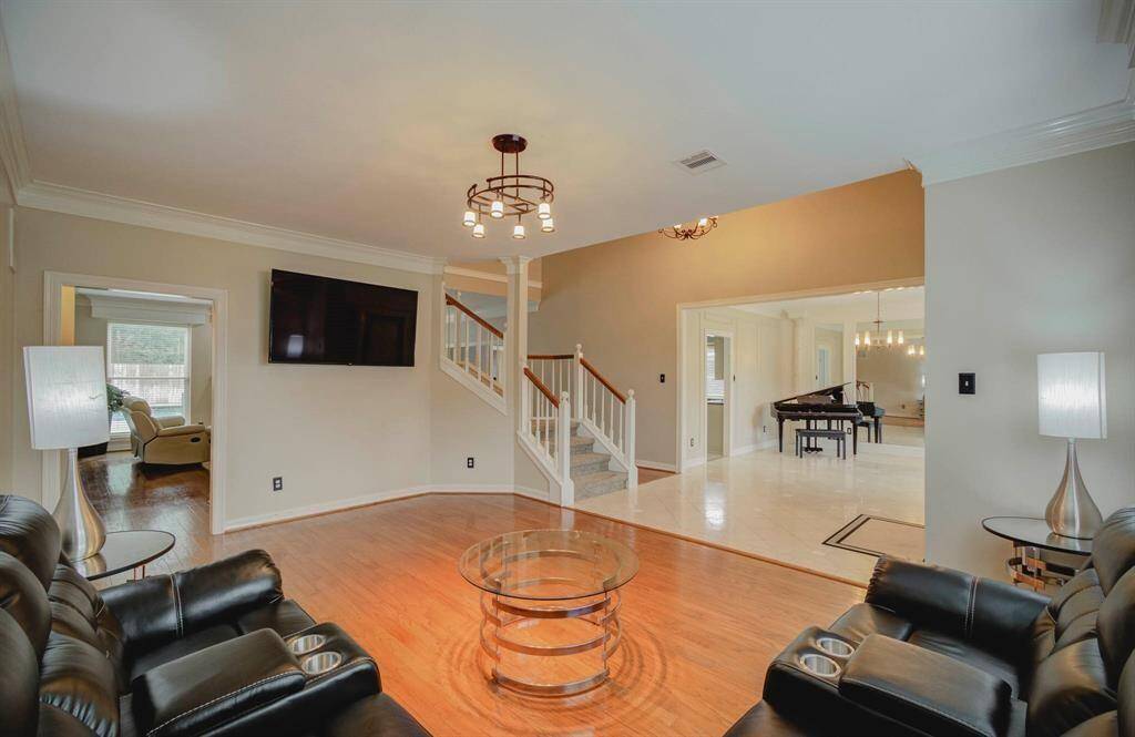 Experience seamless entertaining with this home's spacious open floor plan, flowing effortlessly from the living area to the formal living room.