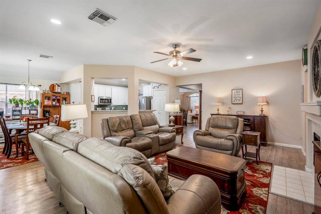 Another look at the spacious living areas, featuring a cozy gas fireplace in the family room and a recessed TV area, perfect for a clean, streamlined entertainment setup. This inviting space offers both comfort and style, making it ideal for relaxing or hosting guests.