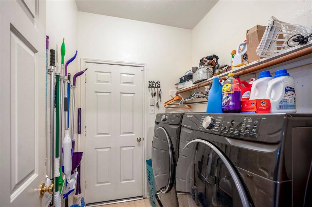 The laundry room, conveniently located with easy access to the garage, offering both practicality and a seamless transition between the home and the garage space.