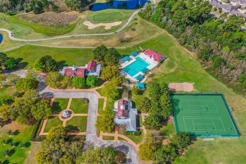 This aerial view shows a picture of ONE of the two community center areas in Windrose. Here you can see our Meeting House, Club House, courtyard area, 1 of 2 of the pools in the community, & tennis courts. PLUS there is a large green space for soccer goals.