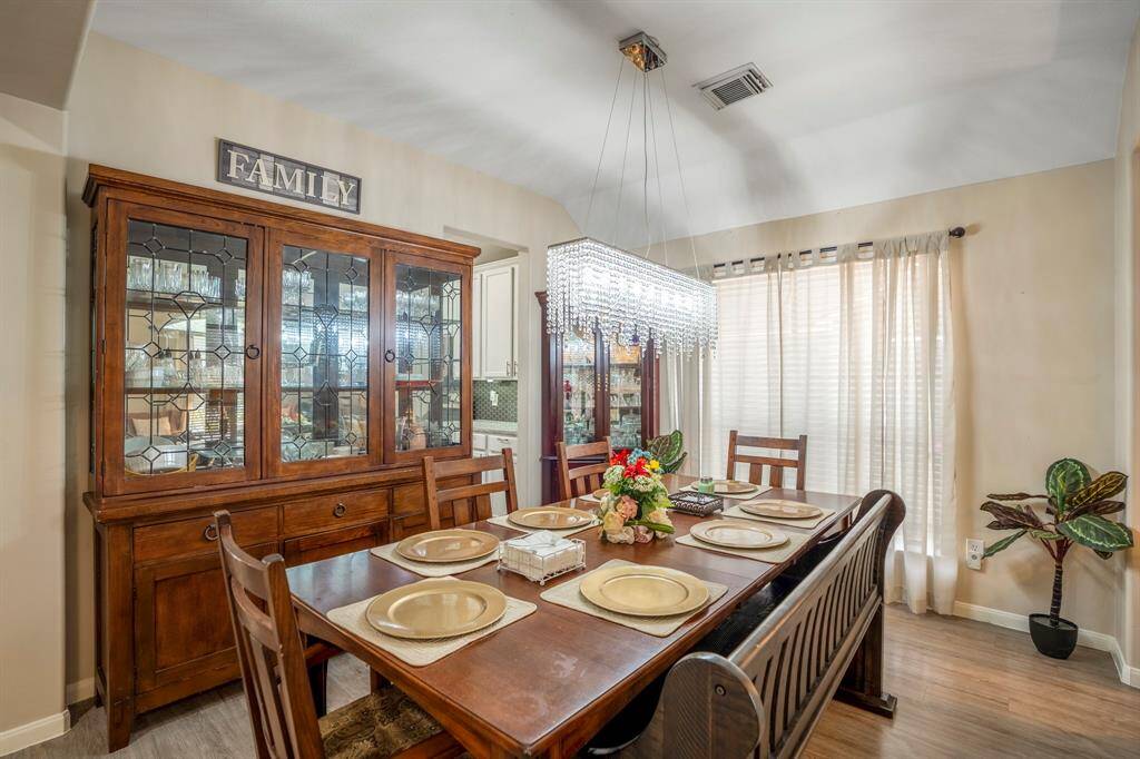 A closer look at the formal dining area, offering an elegant space for family meals and special occasions, seamlessly connected to the formal living area.