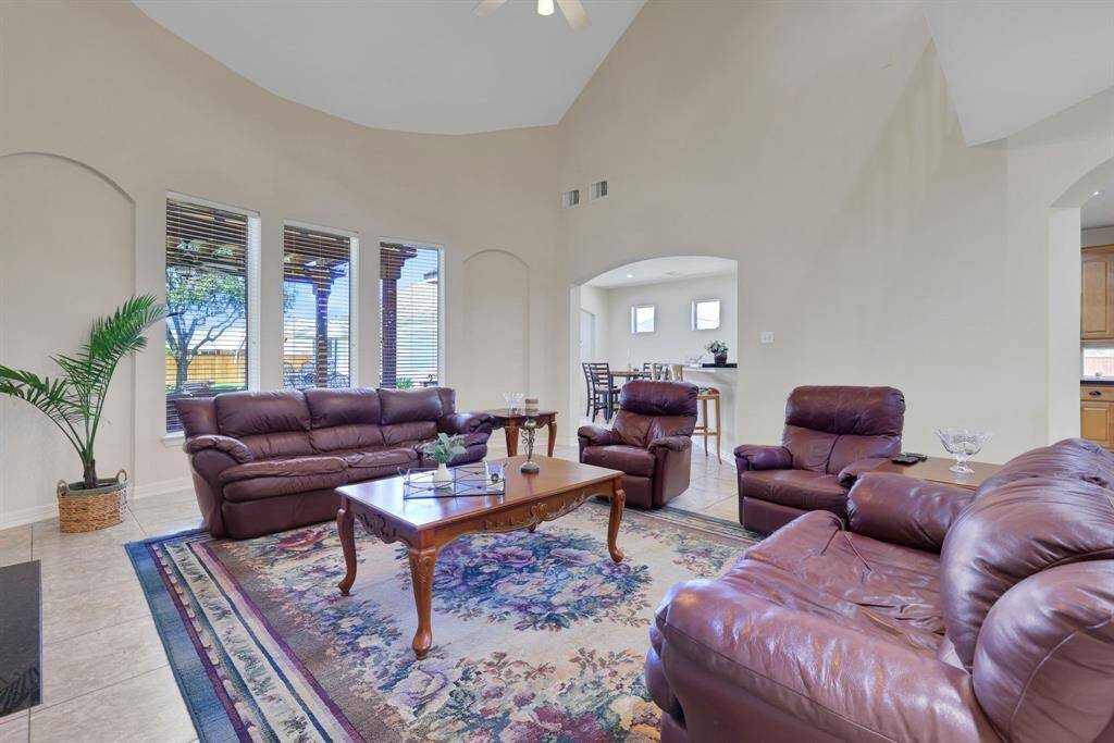 Cozy fireplace in the family room and windows with views of the backyard.