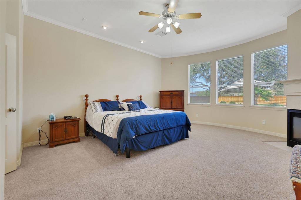 Primary bathrooom offers his and hers vanities with granite countertops and a large separate shower plus a large soaking tub