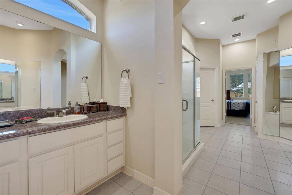 Upstairs you’ll find a game room and three additional secondary bedrooms
