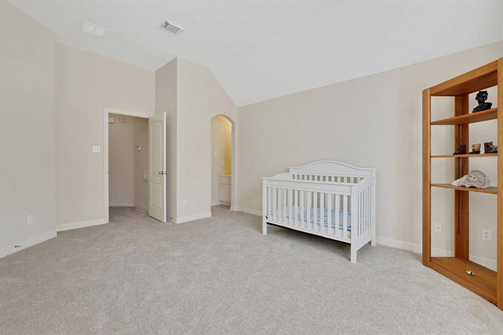 This secondary bedroom has a jack and Jill bathroom