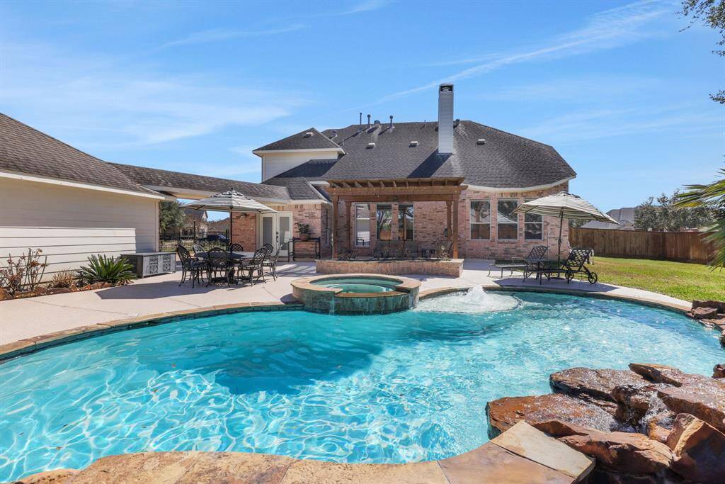 Spa with flagstone coping. Waterfalls