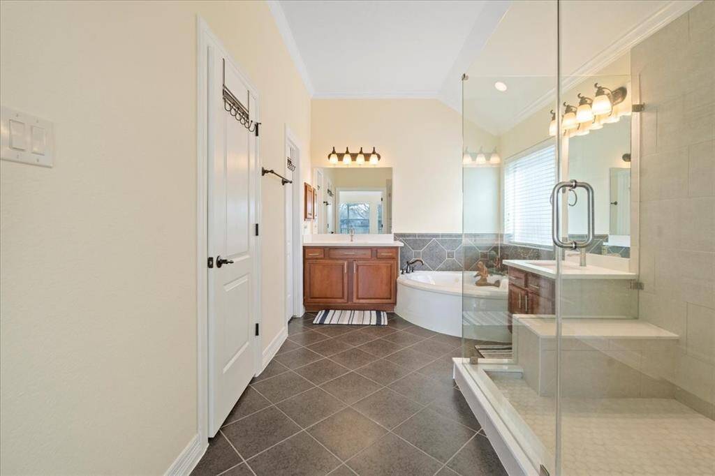 Upgraded primary bathroom - expanded shower, countertops and floors