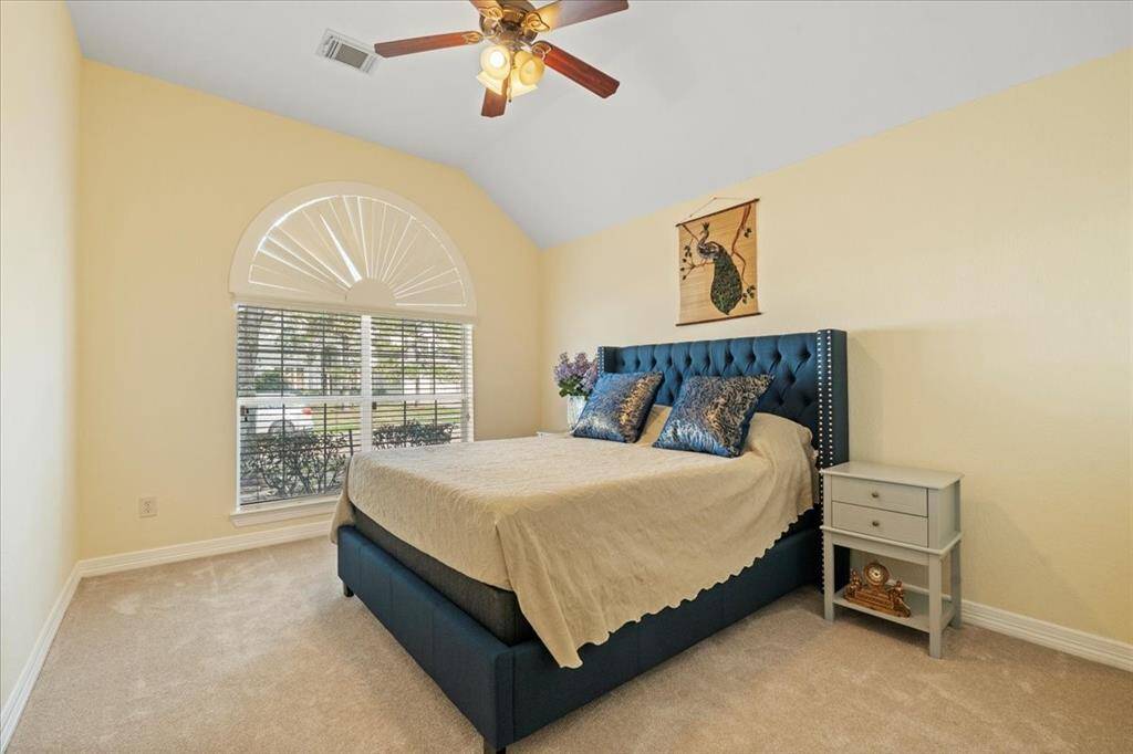 Bedroom 3 - downstairs, walk-in closet, and window of front yard