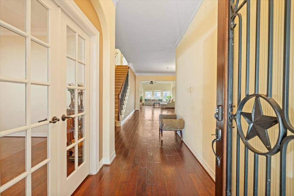 Spacious foyer with study on left and lake views from the back windows