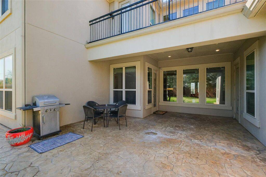 The covered patio offers a shaded area for outdoor dining and gatherings, while the second-floor balcony provides a private escape with elevated views. With ample space for gardening, play, or customization, this backyard is a true extension of the home’s elegance.Enjoy the perfect blend of comfort and outdoor charm—your backyard oasis awaits!
