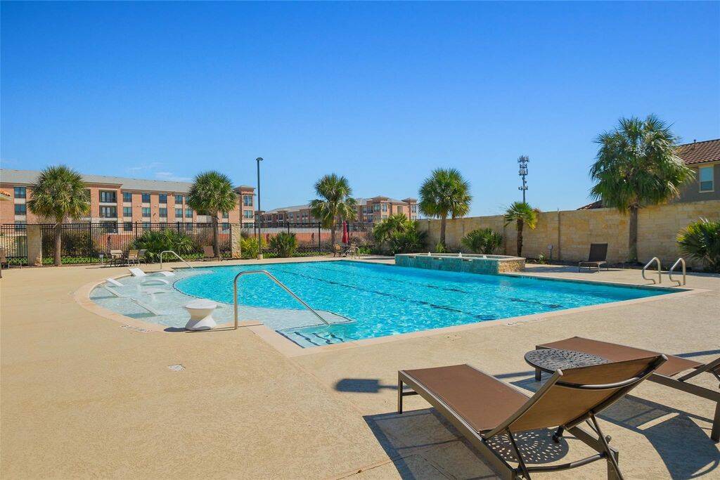 Designed for maximum relaxation and enjoyment, this neighborhood pool offers a refreshing escape just steps from your home. Peaking at 4 feet in depth, the pool is perfect for both leisurely swims and family-friendly fun.For added convenience, the pool area includes a shower and lavatory, ensuring a seamless experience for residents and guests. The recently updated patio furniture—including tables, chairs, umbrellas for shade, and chaise lounges—creates an inviting space to unwind and soak up the sun.