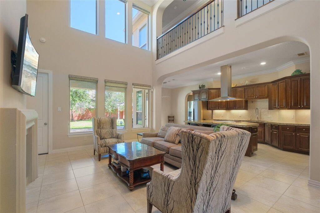 The inviting layout connects effortlessly to the kitchen and dining areas, enhancing both comfort and functionality. This is more than just a living room—it's a statement of refined luxury. Imagine making it yours!