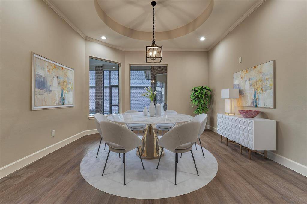The spacious dining room is flooded with natural light and offers a soothing ambiance while  entertaining.