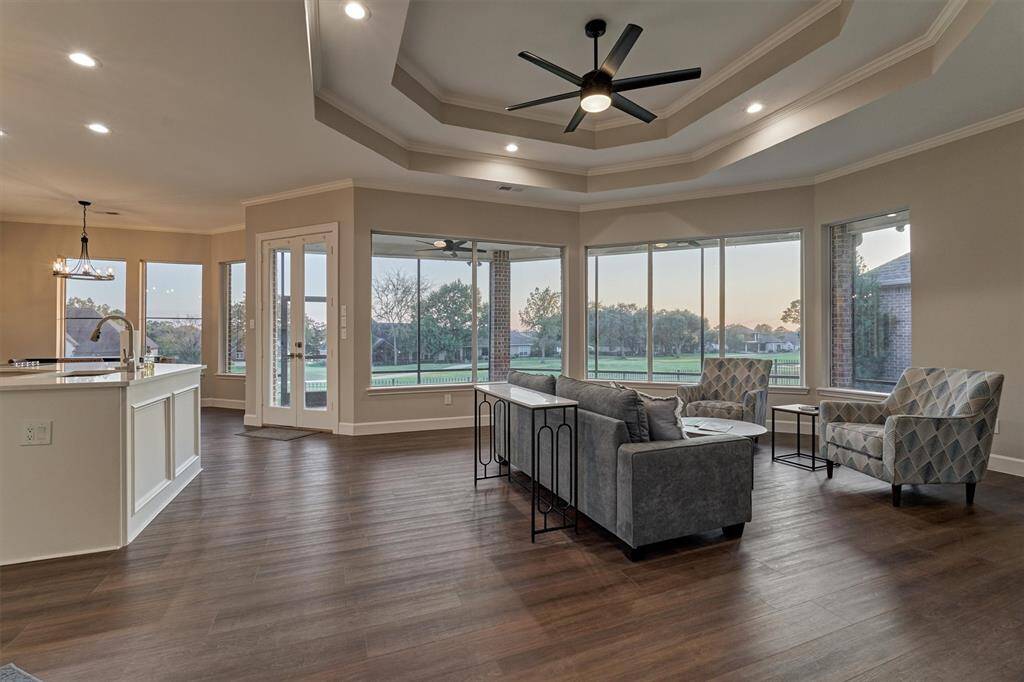 Wow! Upon entering the family room your eyes go directly to the panoramic golf views! The floor-to-ceiling windows provide a picturesque outdoor setting that is just gorgeous!