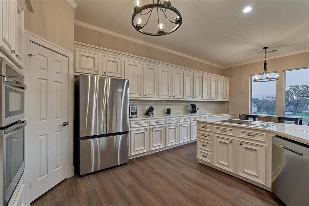 A walk-in pantry is to your left and take a look at the storage! An abundance of cabinetry to house every culinary tool imaginable.