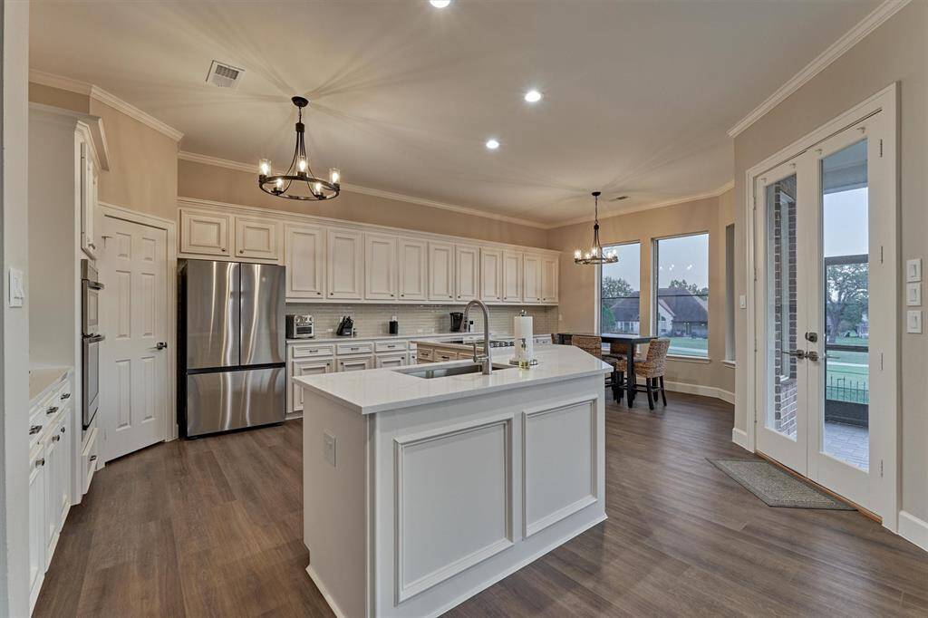 The oversized island provides plenty of space for prepping meals and serving guests.